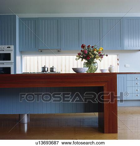 Pastel blue fitted cupboards and units in modern kitchen View Large Photo Image Stock Photo - Pastel blue fitted cupboards and units in modern kitchen. Fotosearch