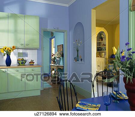 Picture - Patel turquoise units in blue kitchen dining room. Fotosearch