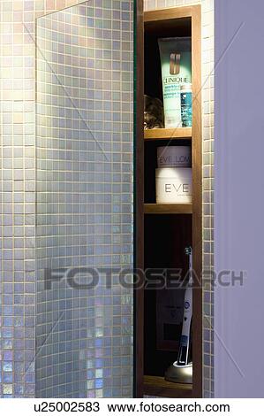 Pearlised mosaic tiles on wall beside bathroom storage shelves View Large Photo Image Stock Image - Pearlised mosaic tiles on wall beside bathroom storage shelves. Fotosearch