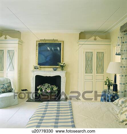 Stock Image - Picture above fireplace in townhouse bedroom. Fotosearch