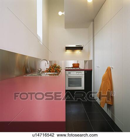 Pink fitted unit in modern white kitchen View Large Photo Image Stock Image - Pink fitted unit in modern white kitchen. Fotosearch