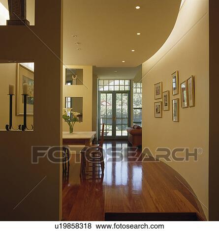 Polished wooden flooring in modern openplan hall dining room View Large Photo Image Stock Photo - Polished wooden flooring in modern openplan hall dining room. Fotosearch