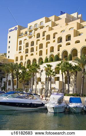 Stock Image - Portomaso Marina and Hilton Hotel, Portomaso, Saint Julian’s, Malta. Fotosearch