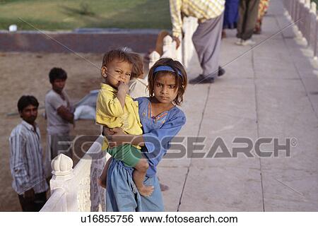 Stock Photograph - Portrait of small Rajastani boy and girl. Fotosearch
