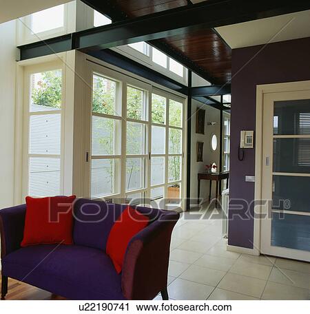 Purple sofa in large modern hall with white floor tiles View Large Photo Image Stock Image - Purple sofa in large modern hall with white floor tiles. Fotosearch