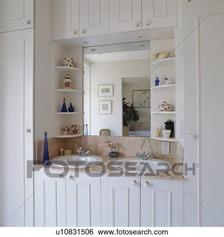 Stock Images Of Shelves On Either Side Mirror Above Double Basins Stock Image Shelves On Either Side Of Mirror Above Double Basins In White Vanity Unit