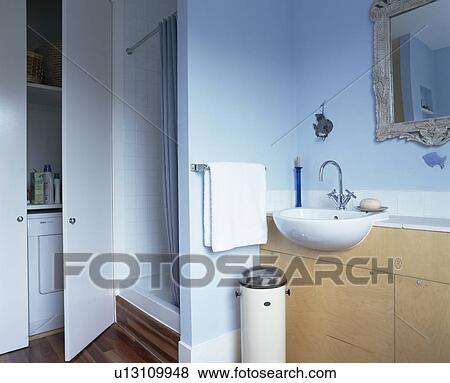 Shower cabinet in traditional blue bathroom View Large Photo Image Stock Photo - Shower cabinet in traditional blue bathroom. Fotosearch