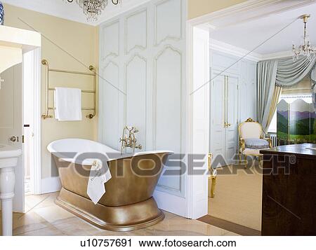 Stock Image - Slipper bath in ensuite bathroom. Fotosearch