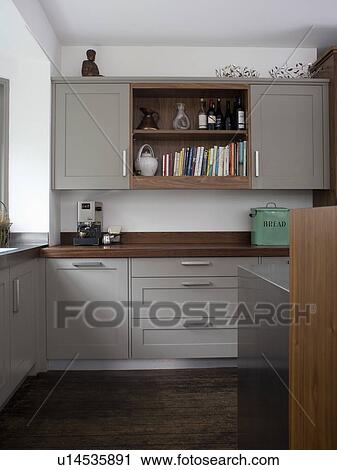 Small modern kitchen with fitted grey wall cupboard and units View Large Photo Image Stock Image - Small modern kitchen with fitted grey wall cupboard and units. Fotosearch