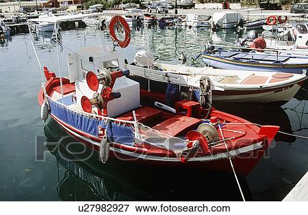 Small red fishing boat moored in the harbour of Argostoli on the island of Kefalonia in Greece View Large Photo Image Stock Photo - Small red fishing boat moored in the harbour of Argostoli on the island of Kefalonia in Greece . Fotosearch