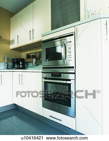 Stainless steel double oven in modern white kitchen View Large Photo Image Stock Image - Stainless steel double oven in modern white kitchen. Fotosearch