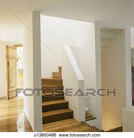 Stock Photograph - Staircase in modern white hall. Fotosearch
