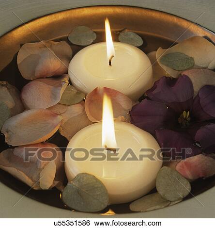 Still-Life of bowl with floating candles and flower petals View Large Photo Image Stock Photograph - Still-Life of bowl with floating candles and flower petals. Fotosearch