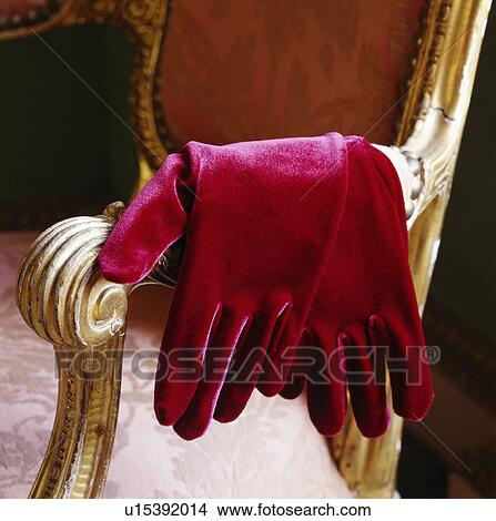 Still-Life of red velvet gloves on gilt-framed chair View Large Photo Image Picture - Still-Life of red velvet gloves on gilt-framed chair. Fotosearch