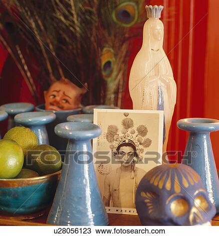Still life of religious statue with blue ceramic candlestick and old photograph View Large Photo Image Stock Image - Still life of religious statue with blue ceramic candlestick and old photograph. Fotosearch
