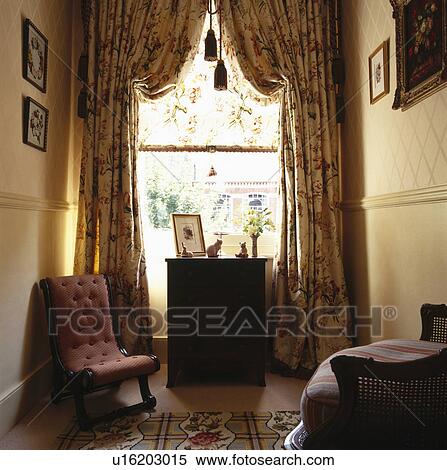 Stock Photography - Swagged curtains on window in traditional hall. Fotosearch