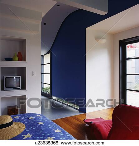 Stock Photography - Television on shelf in modern living room. Fotosearch