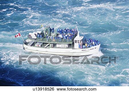 Tourist boat on turbulent river below Niagara Falls View Large Photo Image Stock Photograph - Tourist boat on turbulent river below Niagara Falls . Fotosearch
