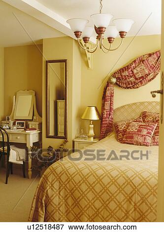 Stock Photo - Traditional bedroom with ceiling light. Fotosearch
