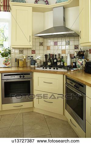 Traditional cream fitted kitchen with two ovens View Large Photo Image Stock Photo - Traditional cream fitted kitchen with two ovens. Fotosearch