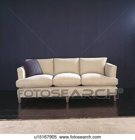 Traditional cream upholstered sofa against black background View Large Photo Image Stock Photography - Traditional cream upholstered sofa against black background. Fotosearch