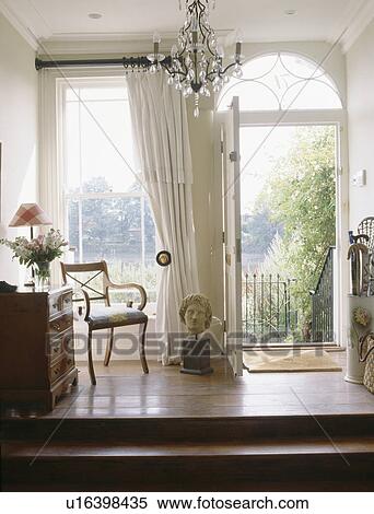 Traditional white hall with open front door View Large Photo Image Stock Photography - Traditional white hall with open front door. Fotosearch
