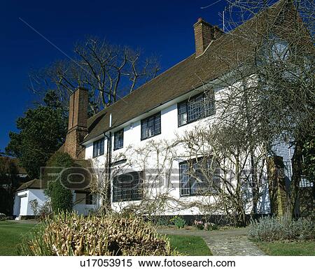 Stock Photography - Traditional white house at night in winter. Fotosearch