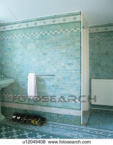 Stock Photo - Turquoise wall tiles in modern bathroom. Fotosearch