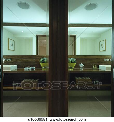 Stock Image - Veneered vanity unit in modern bathroom. Fotosearch