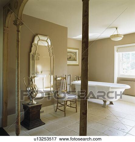 Venetian Mirror And Rolltop Bath In Contemporary Bathroom With