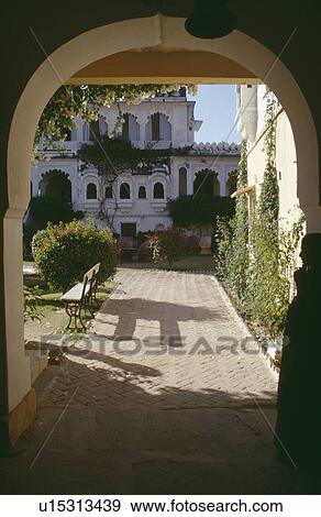 View through arch to tranquil courtyard in hotel at Rawla Narlai in Rajastan View Large Photo Image Stock Photo - View through arch to tranquil courtyard in hotel at Rawla Narlai in Rajastan. Fotosearch