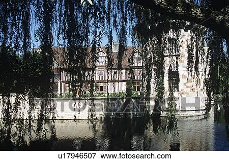 View through willow trees of Chateau de St-Germain-de-Livet, Lisieux, Normandy, France View Large Photo Image Stock Photo - View through willow trees of Chateau de St-Germain-de-Livet, Lisieux, Normandy, France. Fotosearch