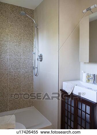 Walk-in shower with pebble wall tiles and rectangular white basin View Large Photo Image Stock Photography - Walk-in shower with pebble wall tiles and rectangular white basin. Fotosearch