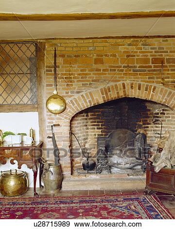 Warming Pan On Brick Fireplace In Old Country House Stock Photo