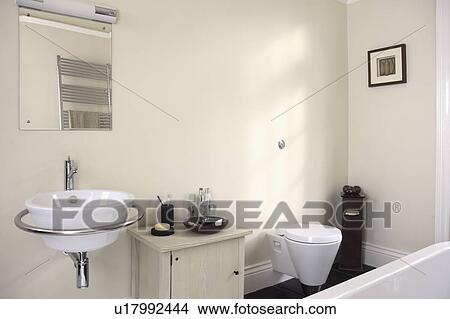 Picture - White basin in chrome rail in modern bathroom. Fotosearch