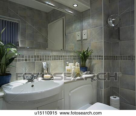 White basin in vanity unit in grey tiled bathroom View Large Photo Image Stock Photography - White basin in vanity unit in grey tiled bathroom. Fotosearch