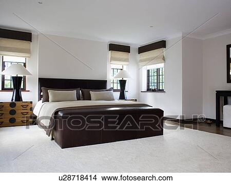 White Carpet And Large Leather Chest In Modern White Bedroom