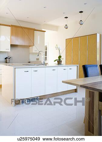 White ceramic tiled floor in large modern kitchen View Large Photo Image Stock Photo - White ceramic tiled floor in large modern kitchen. Fotosearch