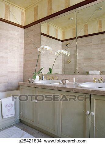 White orchid on vanity unit in pink tiled bathroom View Large Photo Image Picture - White orchid on vanity unit in pink tiled bathroom. Fotosearch