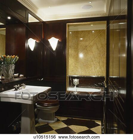 White pedestal basin in mahogany panelled traditional bathroom View Large Photo Image Stock Photograph - White pedestal basin in mahogany panelled traditional bathroom. Fotosearch