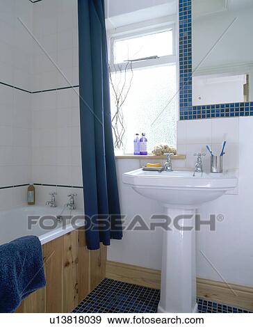 White pedestal basin in small white economy-style bathroom View Large Photo Image Stock Photo - White pedestal basin in small white economy-style bathroom. Fotosearch