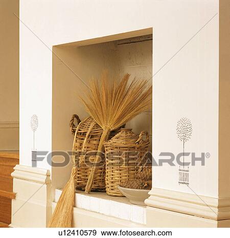 Wicker bottles and brush in kitchen alcove View Large Photo Image Stock Photo - Wicker bottles and brush in kitchen alcove. Fotosearch