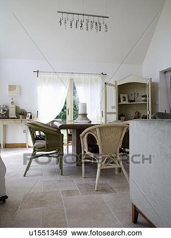 Wicker Chairs And Travertine Flooring In Modern White Country