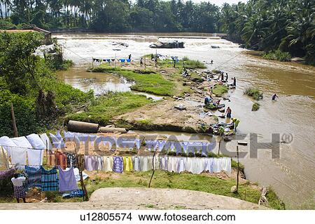 Women washing clothes in a river, Tamil Nadu, India View Large Photo Image Picture - Women washing clothes in a river, Tamil Nadu, India. Fotosearch
