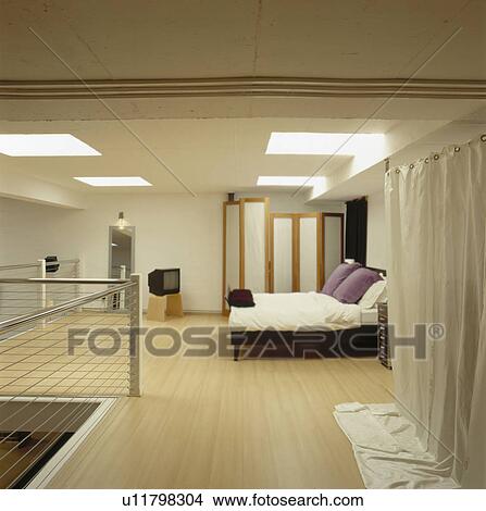 Wooden flooring in large loft-conversion bedroom View Large Photo Image Picture - Wooden flooring in large loft-conversion bedroom. Fotosearch