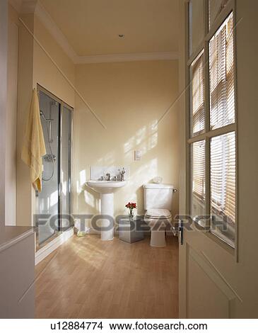 Wooden flooring in modern cream bathroom View Large Photo Image Picture - Wooden flooring in modern cream bathroom. Fotosearch