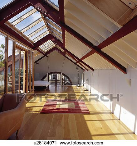 Wooden flooring in modern loft conversion bedroom View Large Photo Image Stock Image - Wooden flooring in modern loft conversion bedroom. Fotosearch