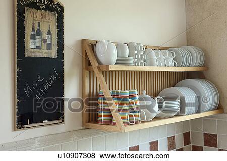 Wooden Plate Rack Acts As Convenient Storage In Modern Kitchen In