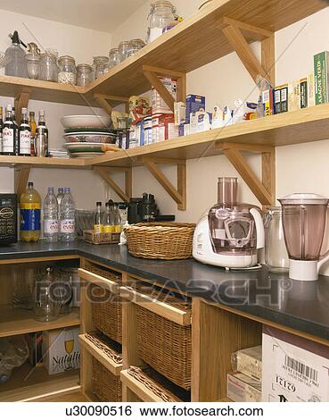 Wooden shelves above food-processor and blender on granite worktop in larder View Large Photo Image Stock Photograph - Wooden shelves above food-processor and blender on granite worktop in larder. Fotosearch