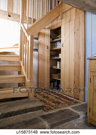 Wooden staircase in hall with fitted pine storage cupboard View Large Photo Image Stock Photo - Wooden staircase in hall with fitted pine storage cupboard. Fotosearch